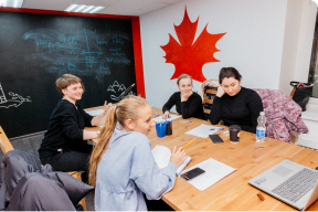 Three girls talking on class