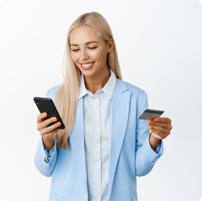 Young blonde woman holding phone mobile with right hand and credit card with the left hand